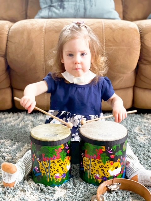 Aly playing drums.