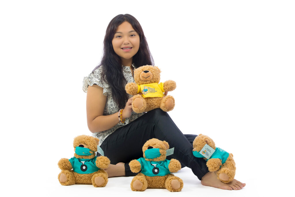 2024 Champion Child, Janessa Dumas with Dr. Goodbear stuffies.