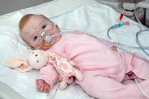 Baby Amy in her hospital bed