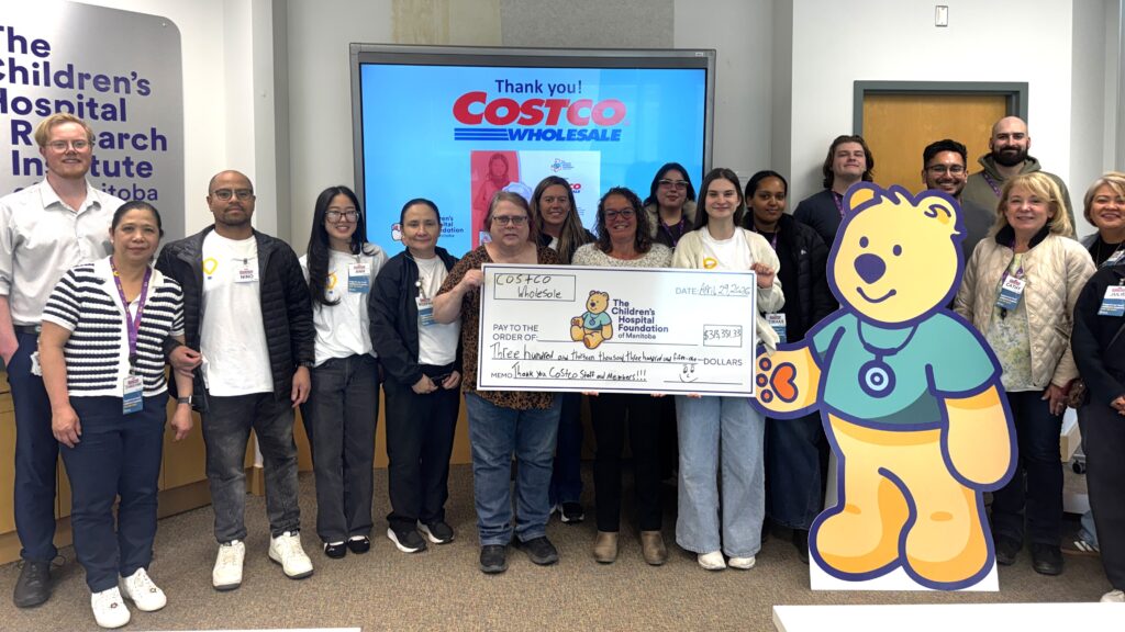 Costco employees present a cheque for more than $313,000 to the Children's Hospital Foundation of Manitoba.