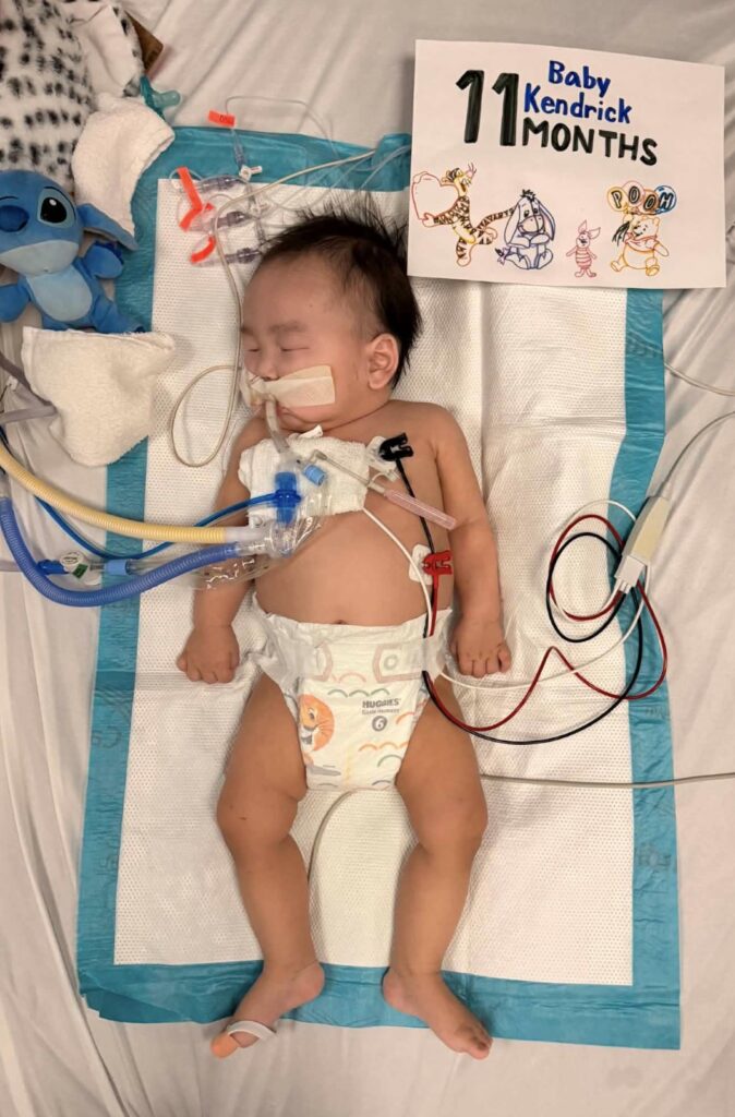 Baby Kendrick in the hospital at 11 months old.