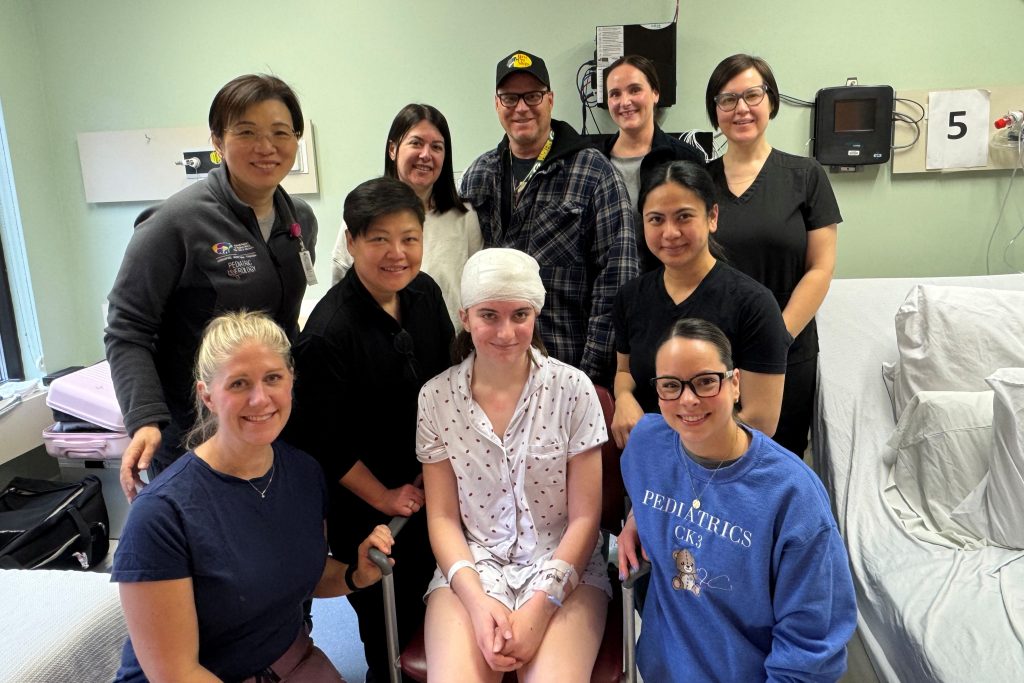 Cloé and her health care team in hospital after her sEEG surgery.