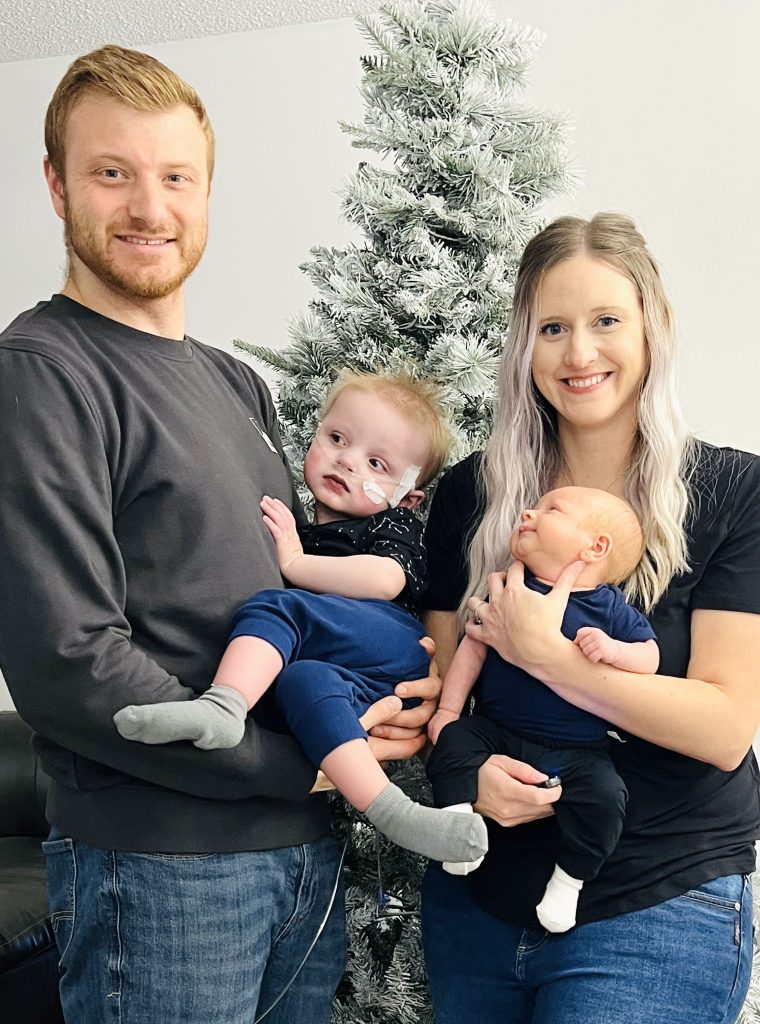 Mark and Kelsey with their sons Paxton and Rex.