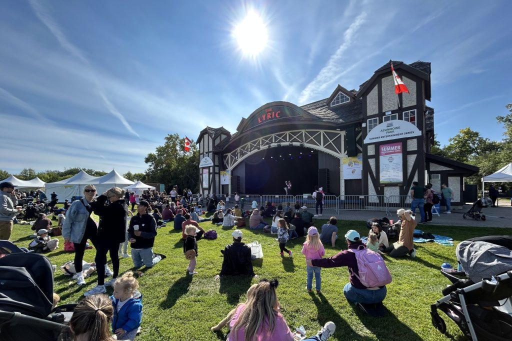 Families watch performers on the Lyric Stage at Teddy Bears' Picnic.